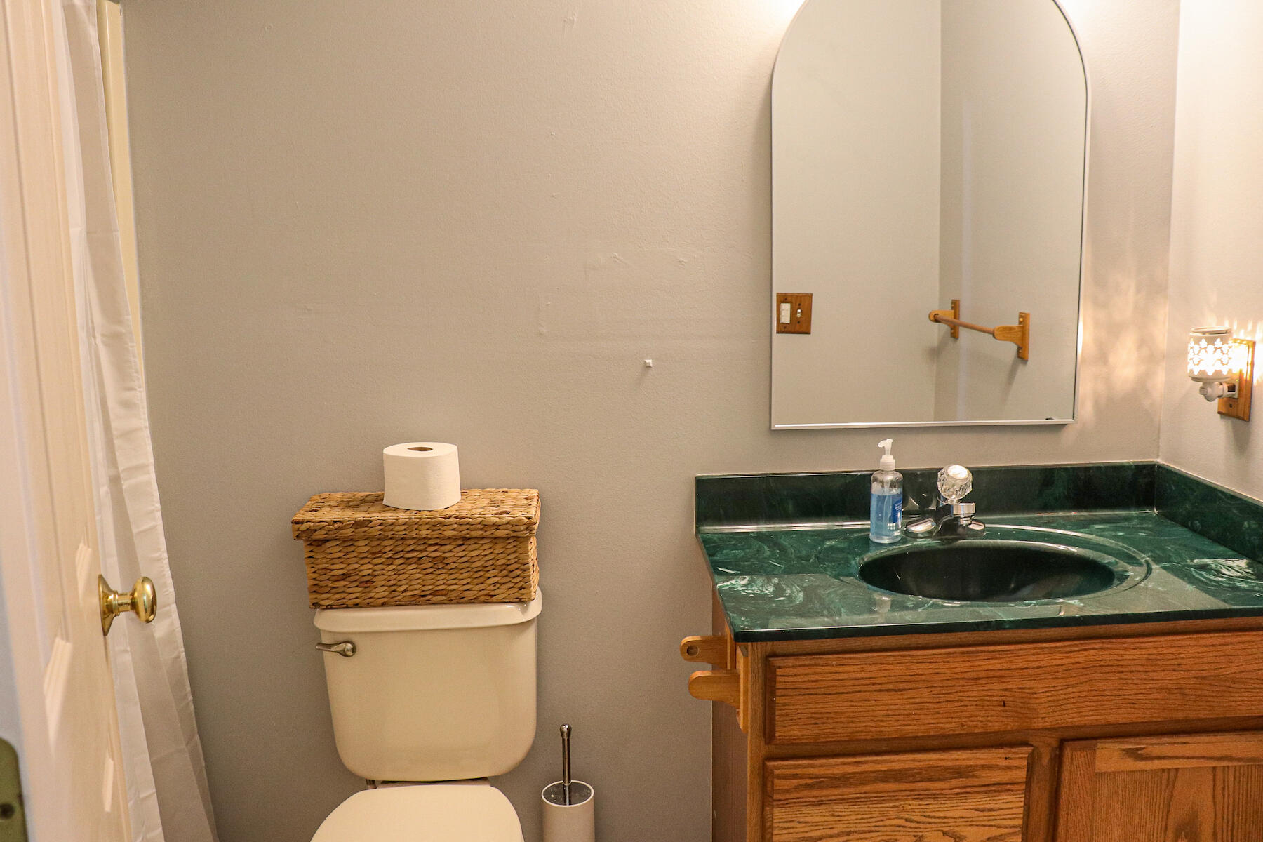 1008 Dusty Rock Road Northwest Riner, VA 24149 - Photo 22 of 28 a bathroom with a granite countertop sink and a mirror