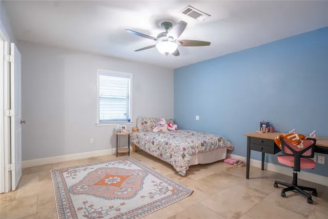 a bedroom with a bed and a dresser