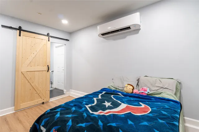 a bathroom with a toilet a sink and a mirror
