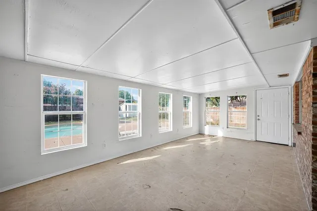 an empty room with windows