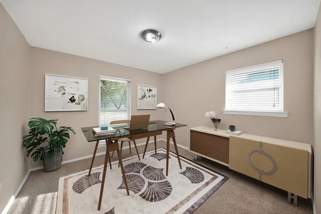 a workspace with furniture and window