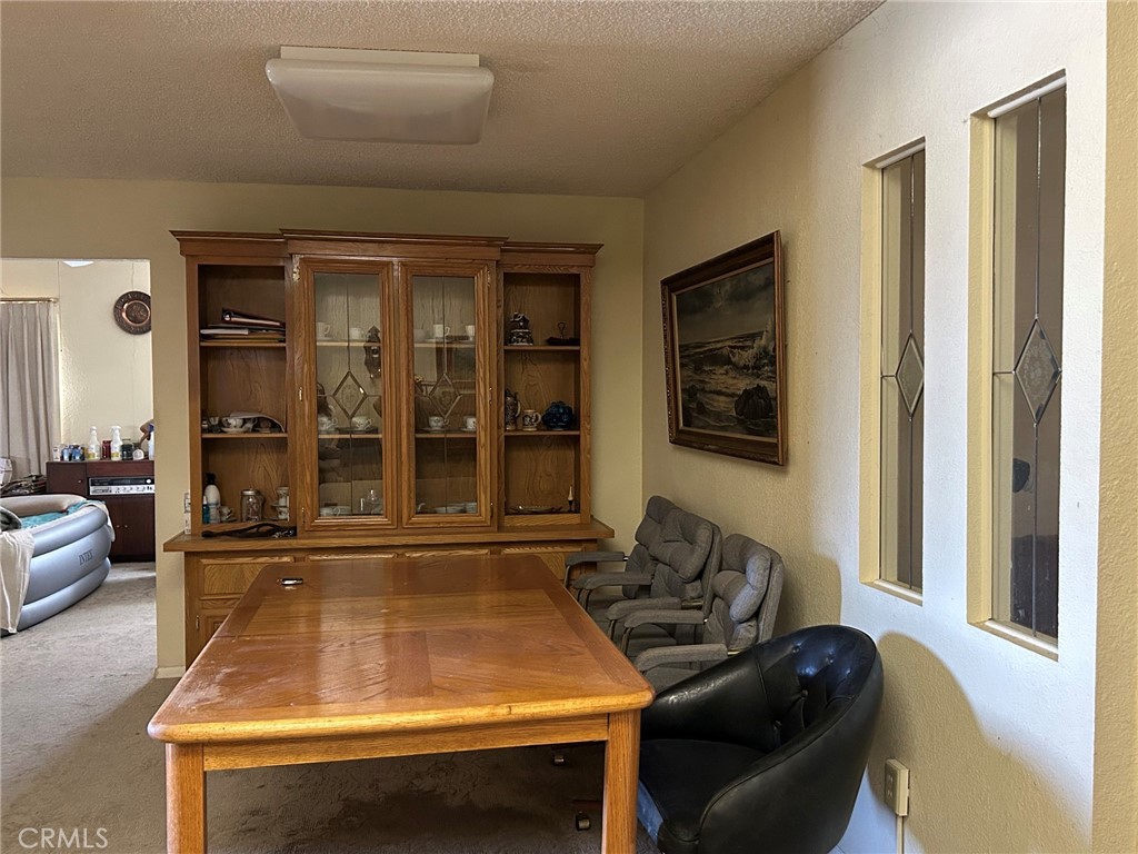27250 Murrieta Road, Unit 347 Menifee, CA 92586 - Photo 4 of 39 a room with furniture and a potted plant