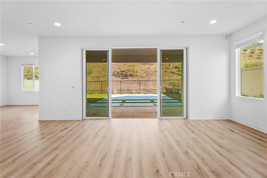 18121 Outlook Way Saugus, CA 91350 - Photo 13 of 59 wooden floor in an empty room with a window