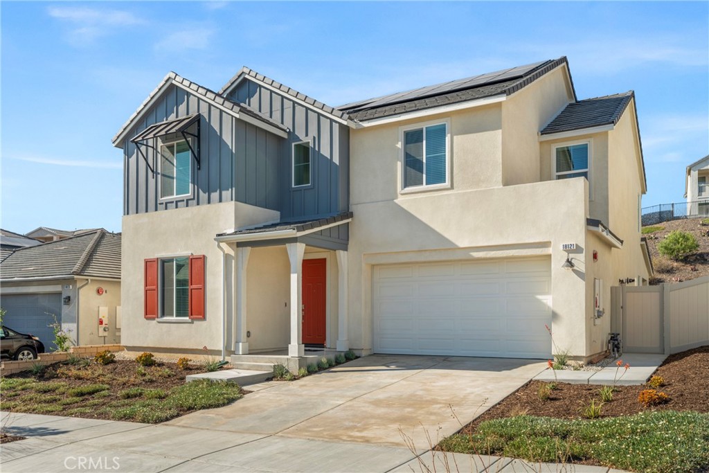 18121 Outlook Way Saugus, CA 91350 - Photo 2 of 59 a front view of a house with a yard