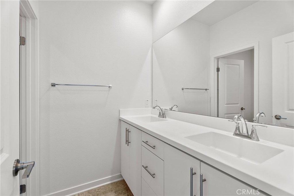 18121 Outlook Way Saugus, CA 91350 - Photo 23 of 59 a bathroom with a sink and a mirror