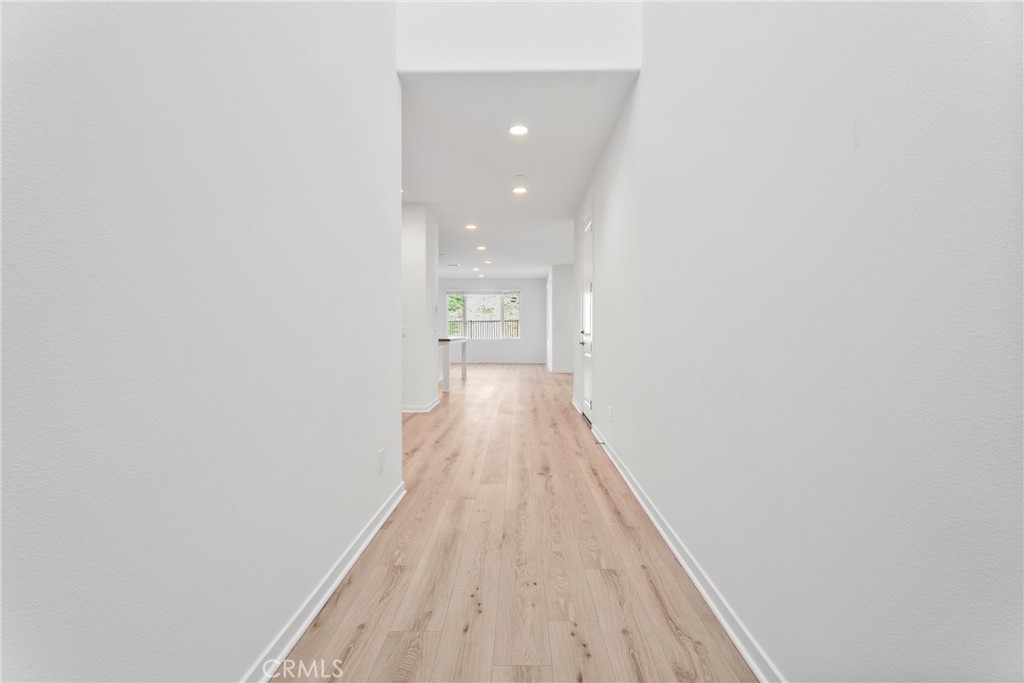18121 Outlook Way Saugus, CA 91350 - Photo 4 of 59 a view of a hallway with wooden floor