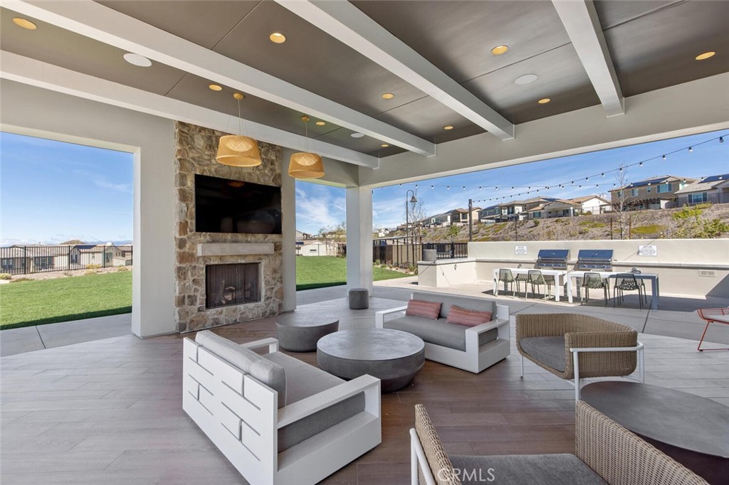 18121 Outlook Way Saugus, CA 91350 - Photo 55 of 59 a living room with fireplace furniture and a large window