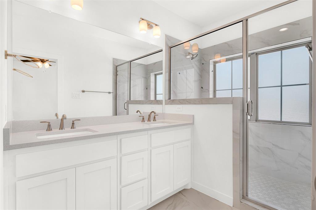 3676 Rickshaw Drive, Unit A Dallas, TX 75229 - Photo 11 of 21 Master bedroom and bath are on the second floor. Luxurious master bath with Double vanity has custom granite countertops and a large, double walk-in shower.