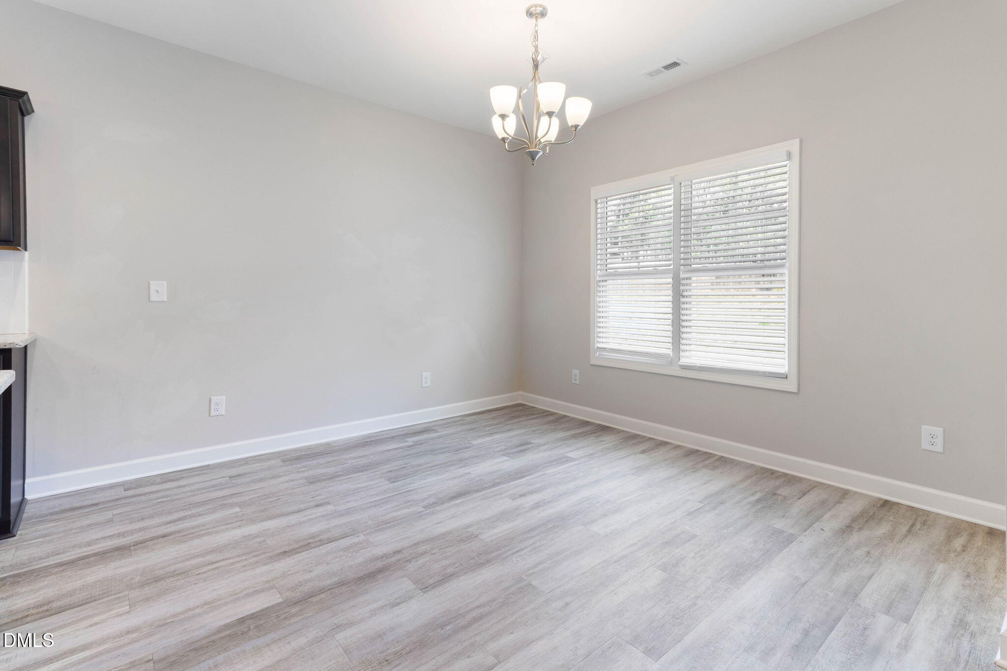 111 Sugarberry Place Spring Lake, NC 28390 - Photo 11 of 29 an empty room with wooden floor and windows