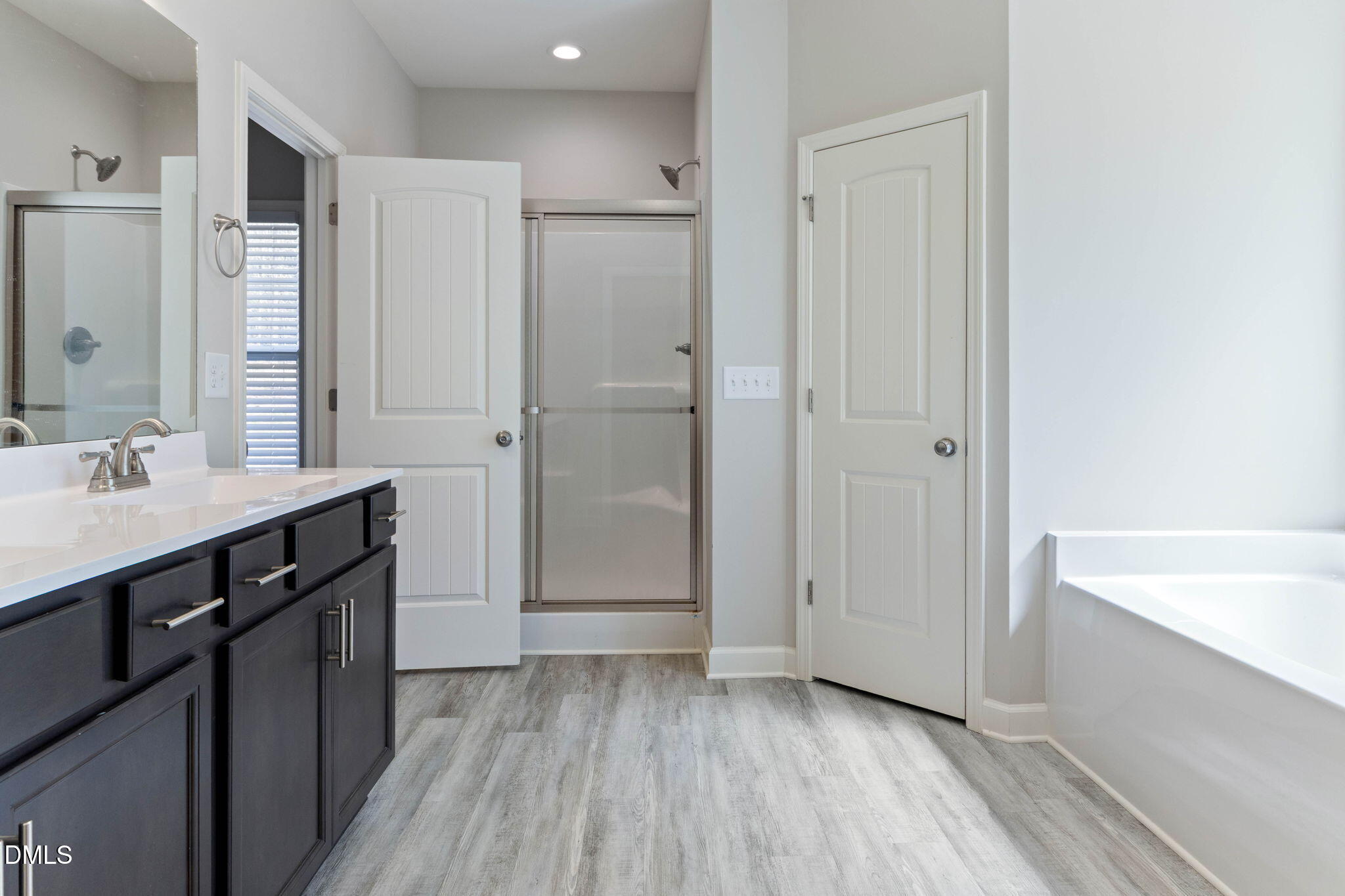 111 Sugarberry Place Spring Lake, NC 28390 - Photo 16 of 29 a bathroom with a sink and a mirror
