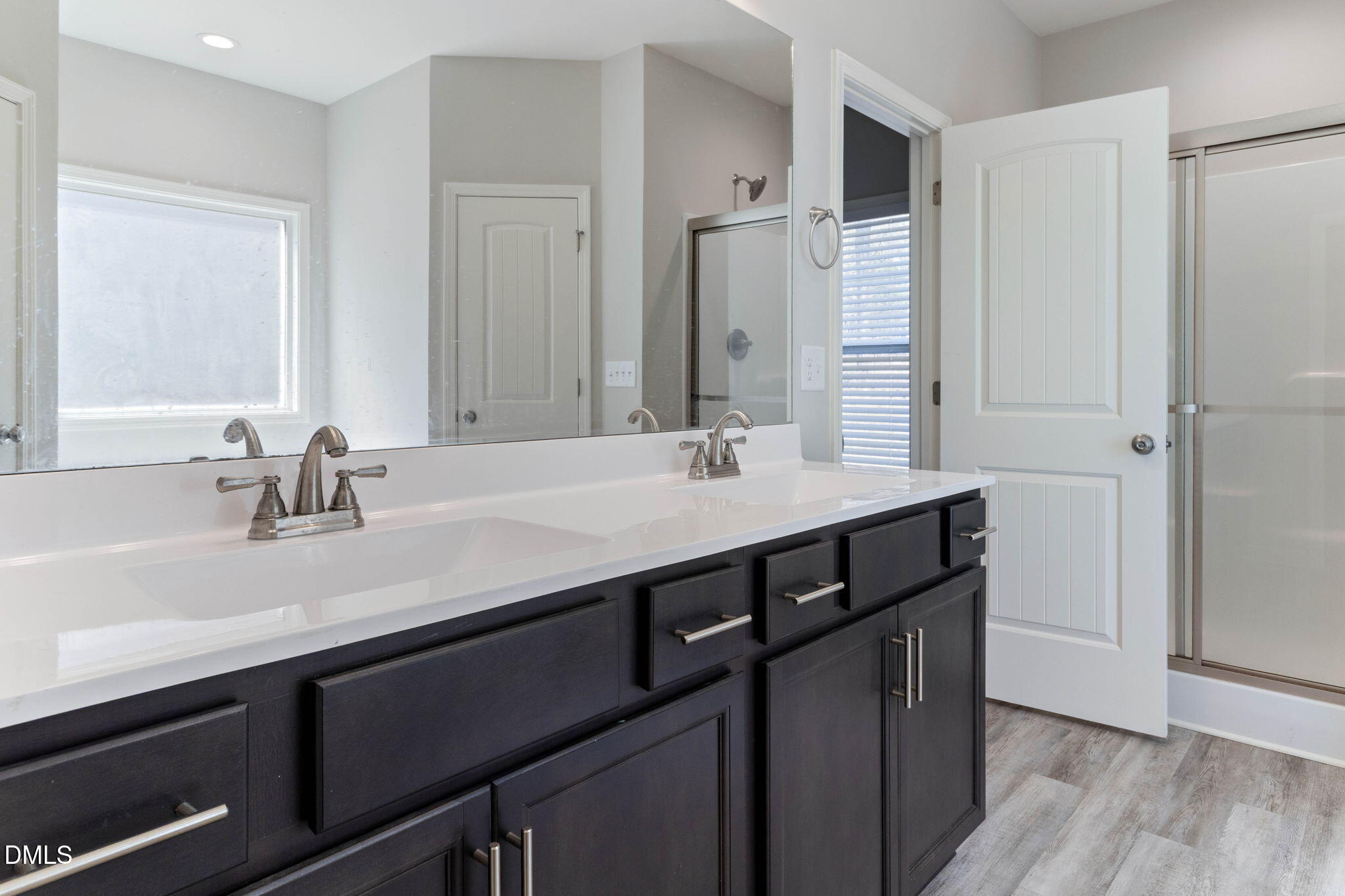 111 Sugarberry Place Spring Lake, NC 28390 - Photo 17 of 29 a bathroom with a sink double vanity and a mirror
