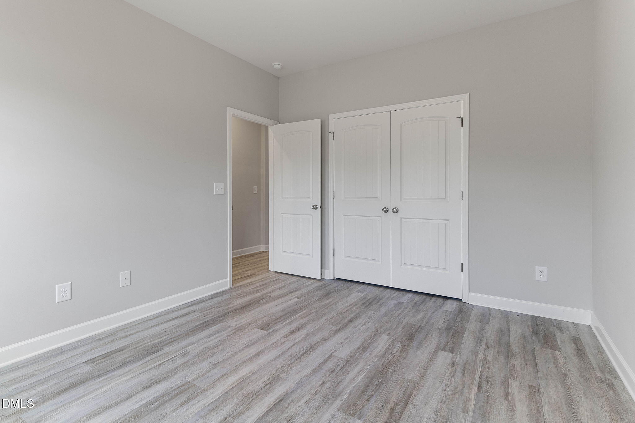 111 Sugarberry Place Spring Lake, NC 28390 - Photo 20 of 29 a view of an empty room with wooden floor