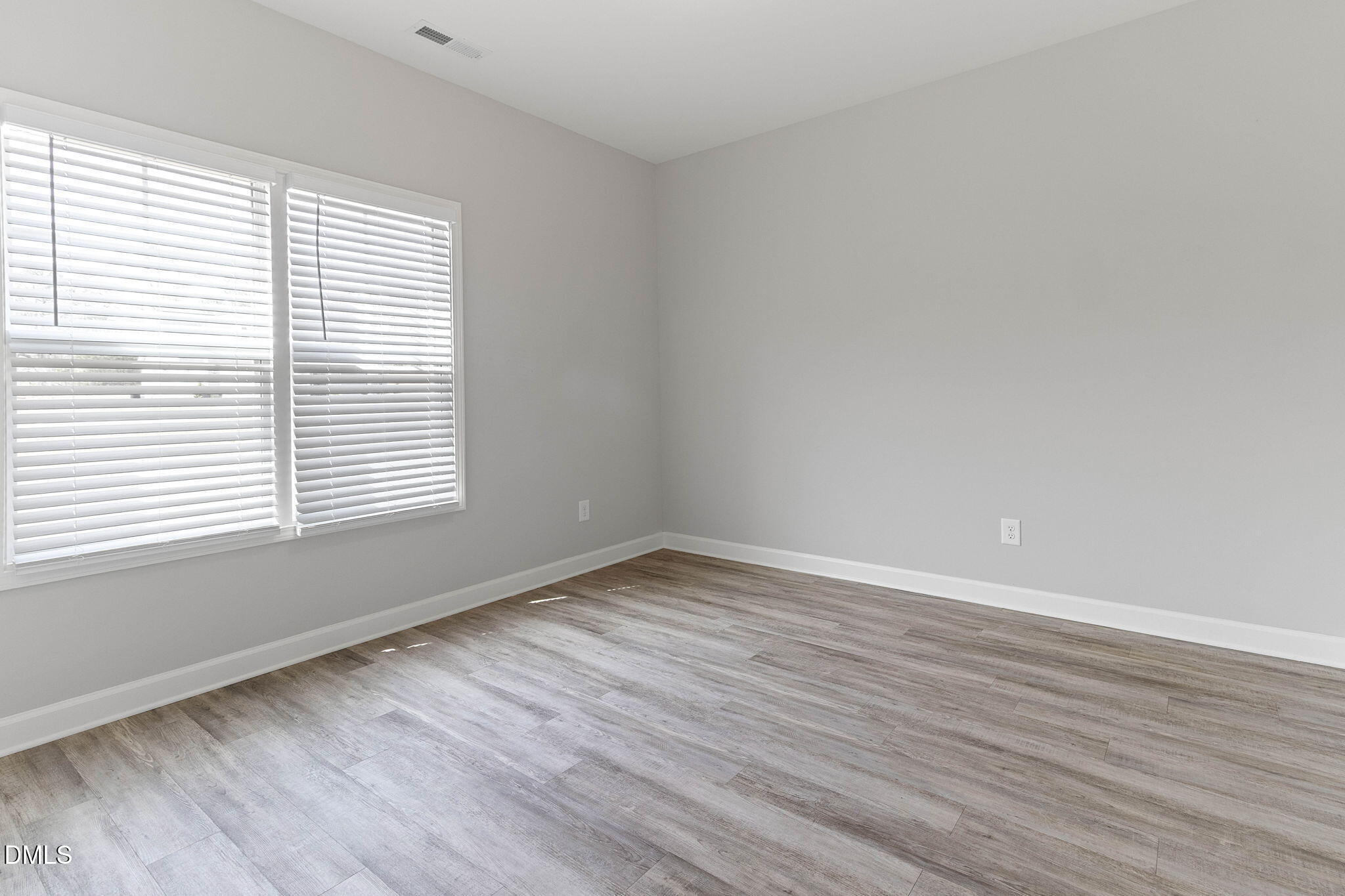 111 Sugarberry Place Spring Lake, NC 28390 - Photo 21 of 29 wooden floor in an empty room with a window