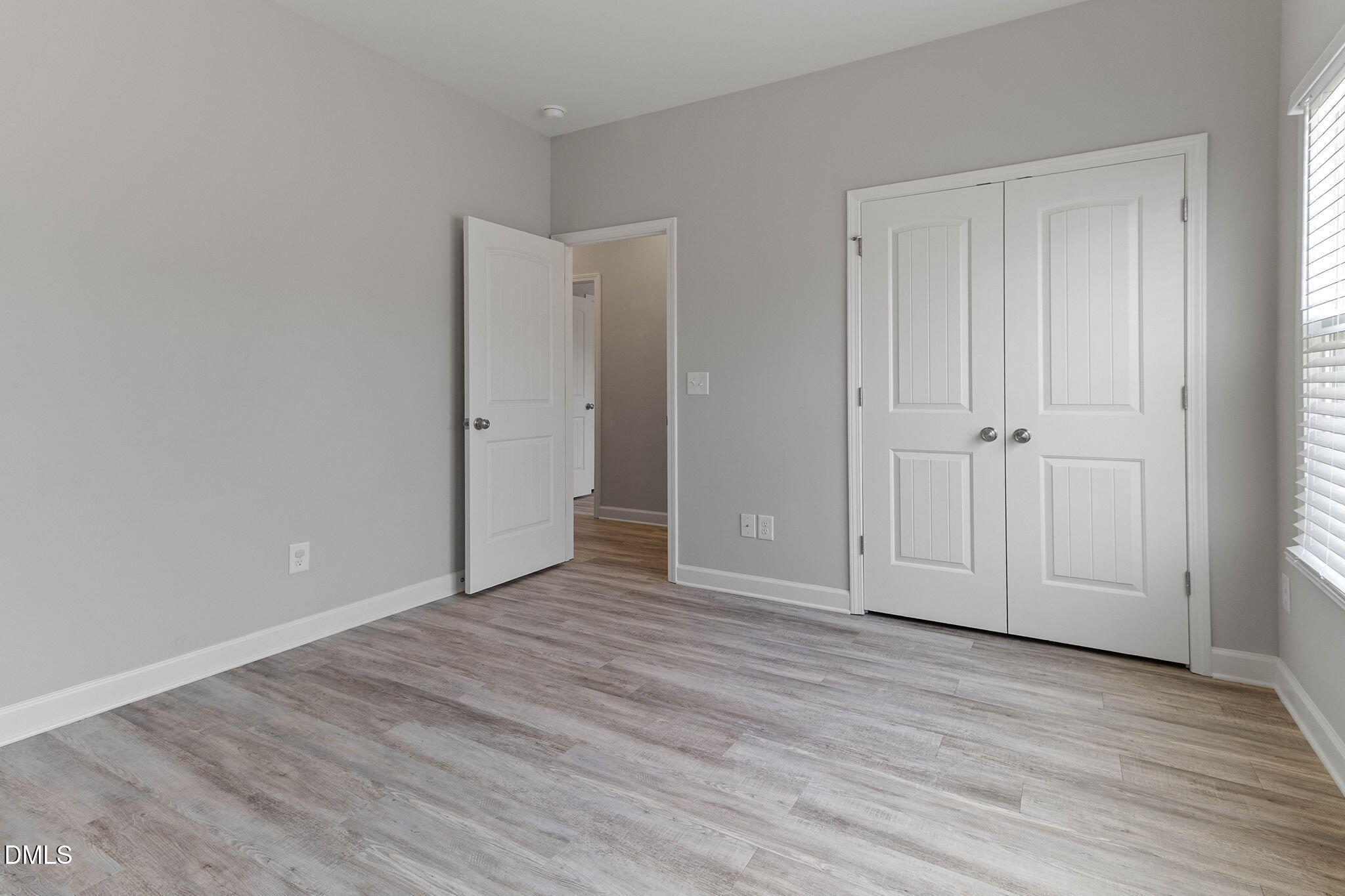 111 Sugarberry Place Spring Lake, NC 28390 - Photo 22 of 29 a view of empty room with wooden floor