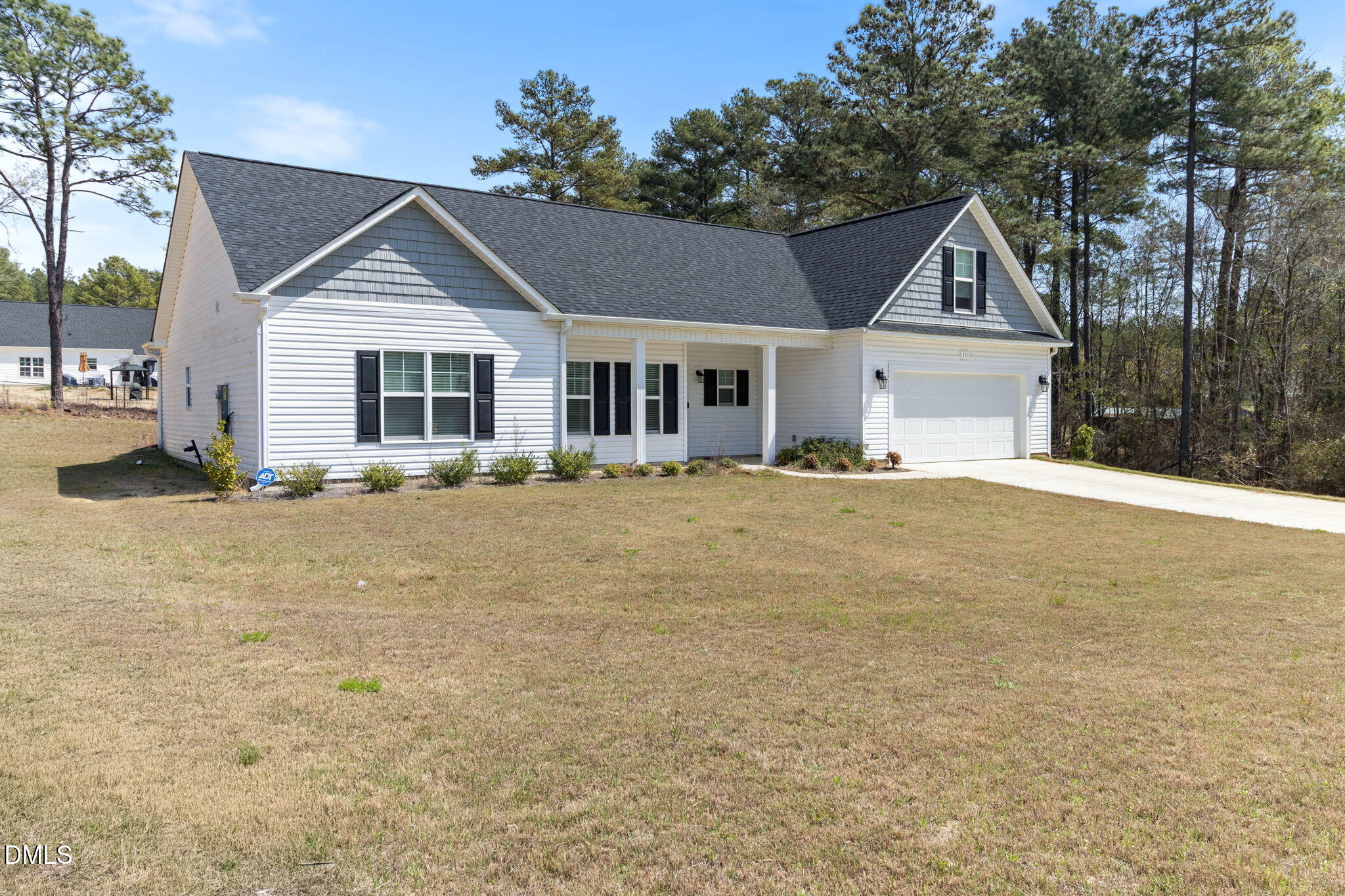 111 Sugarberry Place Spring Lake, NC 28390 - Photo 3 of 29 a front view of a house with a yard