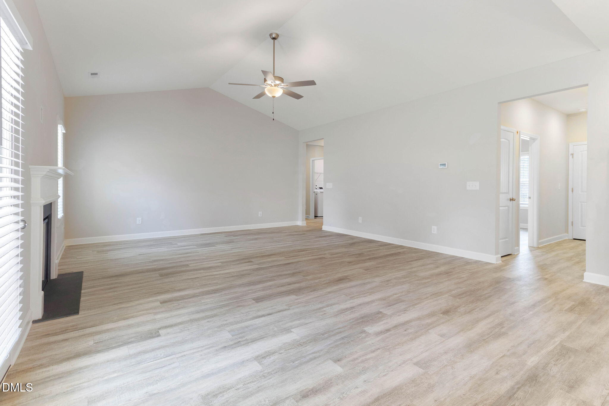 111 Sugarberry Place Spring Lake, NC 28390 - Photo 7 of 29 an empty room with wooden floor and chandelier