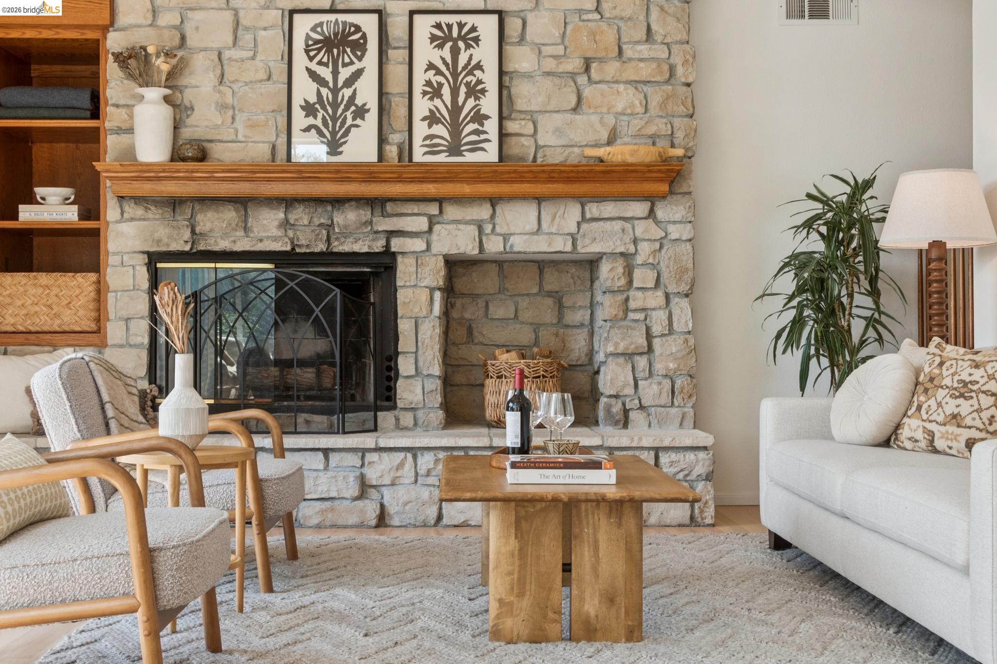 1325 Drury Road Berkeley, CA 94705 - Photo 14 of 71 Stone fireplace featuring a decorative wood mantel and built-in shelving