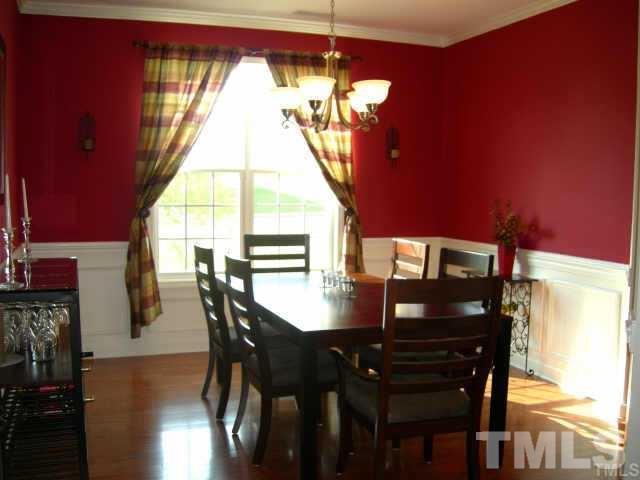 5256 Holly Ridge Farm Road Raleigh, NC 27616 - Photo 3 of 8 a view of a dining room with furniture and window