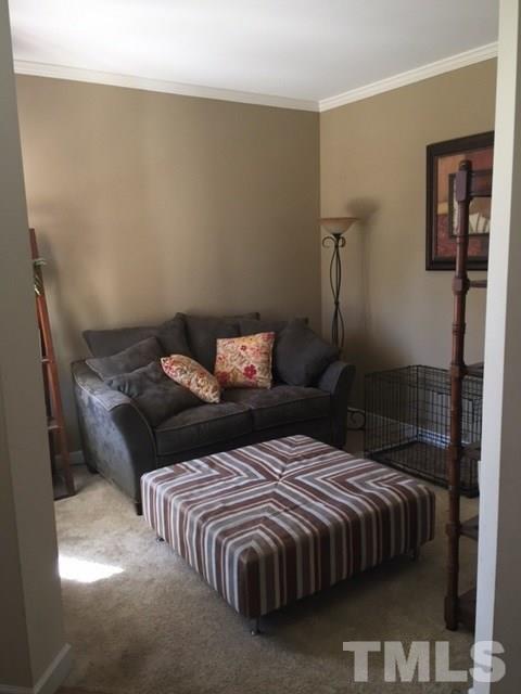 5256 Holly Ridge Farm Road Raleigh, NC 27616 - Photo 5 of 8 a bedroom with a bed and wooden floor