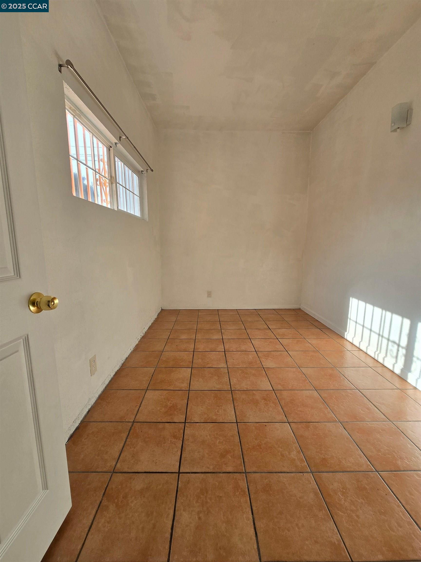 2849 Rheem Avenue Richmond, CA 94804 - Photo 7 of 10 a view of an empty room and window