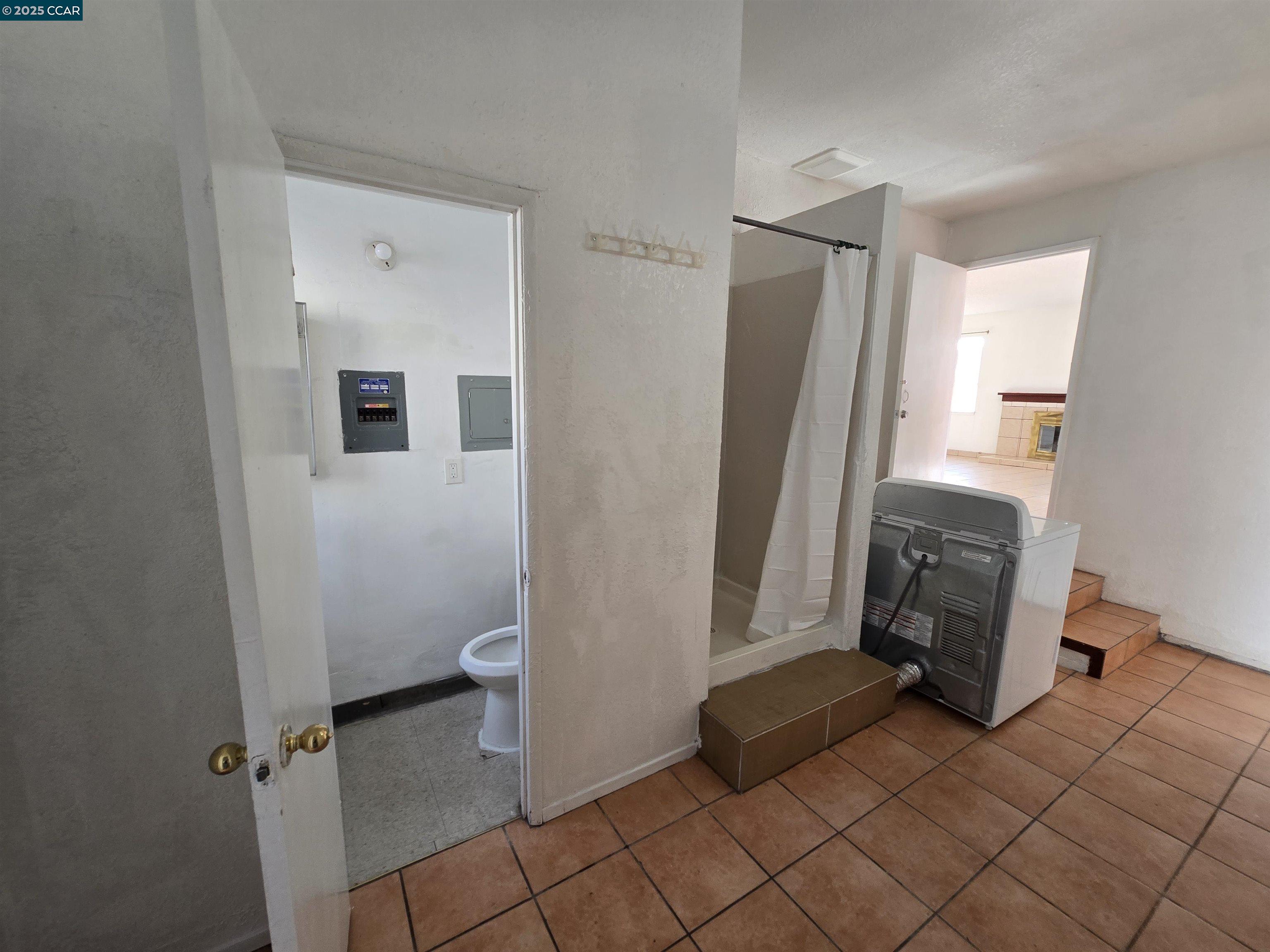 2849 Rheem Avenue Richmond, CA 94804 - Photo 8 of 10 a bathroom with a sink and a mirror