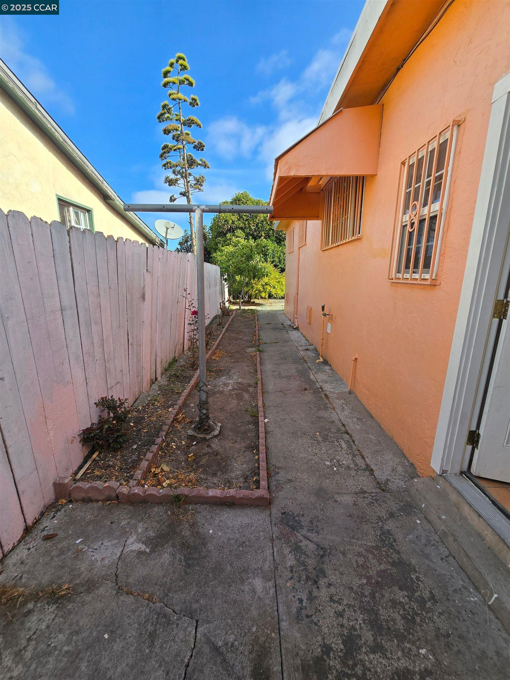 2849 Rheem Avenue Richmond, CA 94804 - Photo 10 of 10 a backyard of a house with a yard