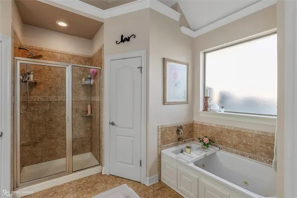a bathroom with a bathtub and shower