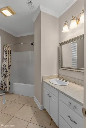 a bedroom with a bed and a table