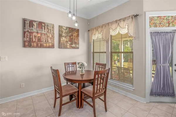 a view of a dining room with furniture window and outside view