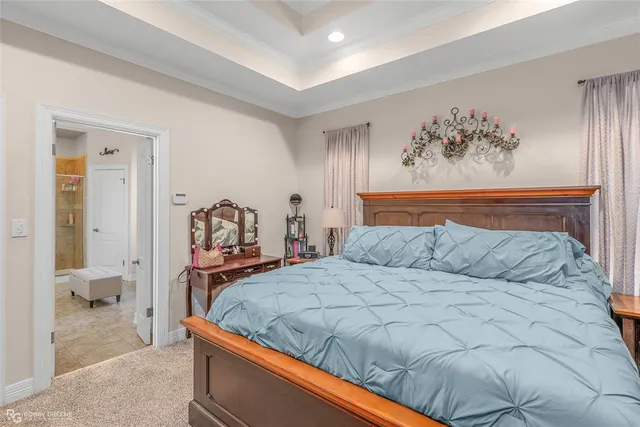 a bedroom with a bed and bathroom