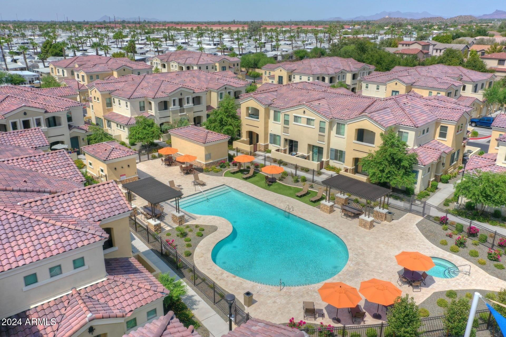 1350 South Ellsworth Road, Unit 2 Mesa, AZ 85209 - Photo 16 of 44 an aerial view of a swimming pool patio and outdoor seating
