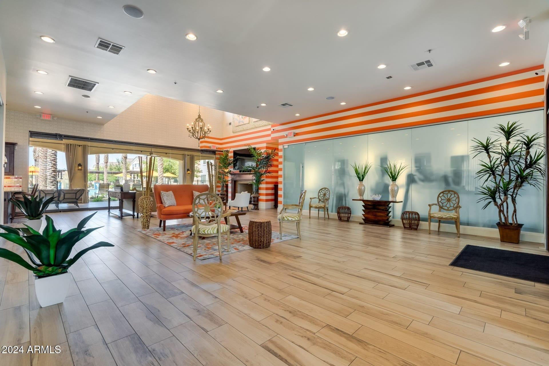 1350 South Ellsworth Road, Unit 2 Mesa, AZ 85209 - Photo 37 of 44 a lobby with furniture and floor to ceiling window