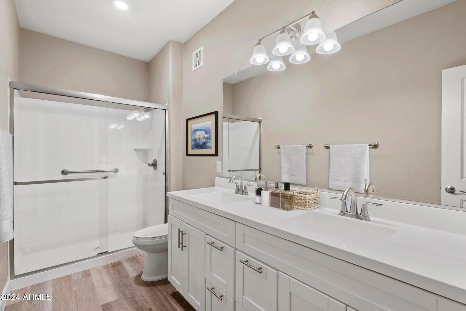 1350 South Ellsworth Road, Unit 2 Mesa, AZ 85209 - Photo 5 of 44 a bathroom with a double vanity sink mirror and toilet