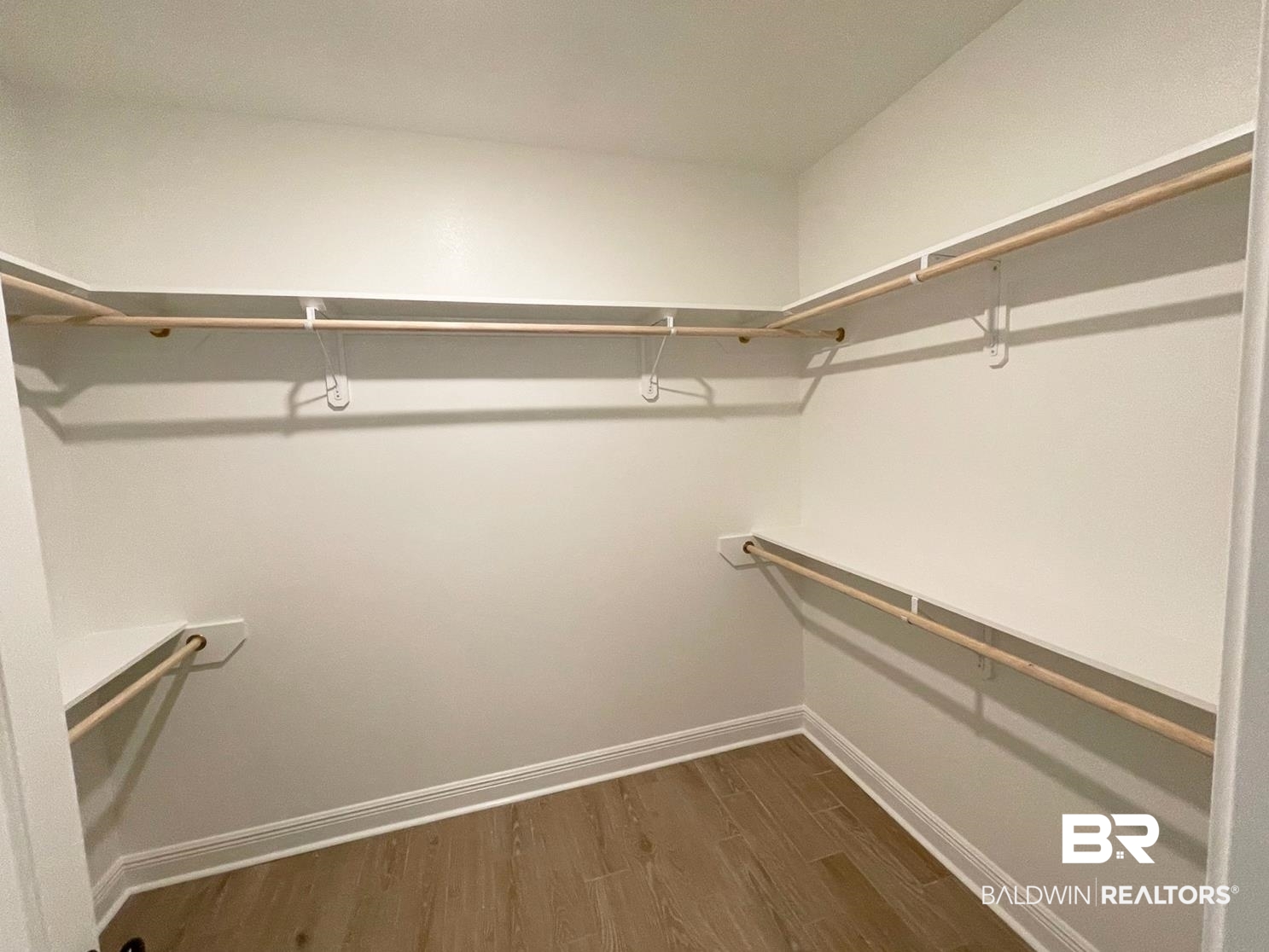 1428 Fenton Circle Foley, AL 36535 - Photo 9 of 15 Spacious closet with dark hardwood / wood-style floors