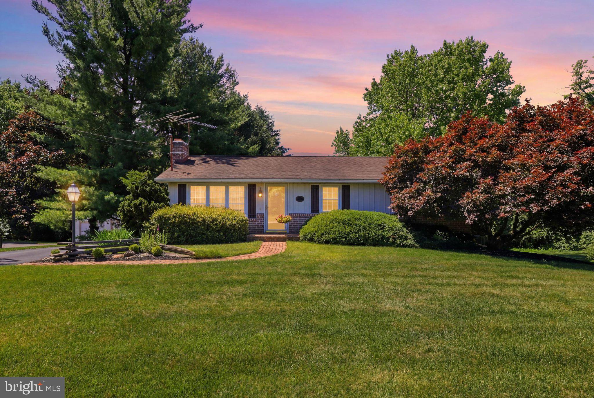 Charming home bathed in twilight hues.