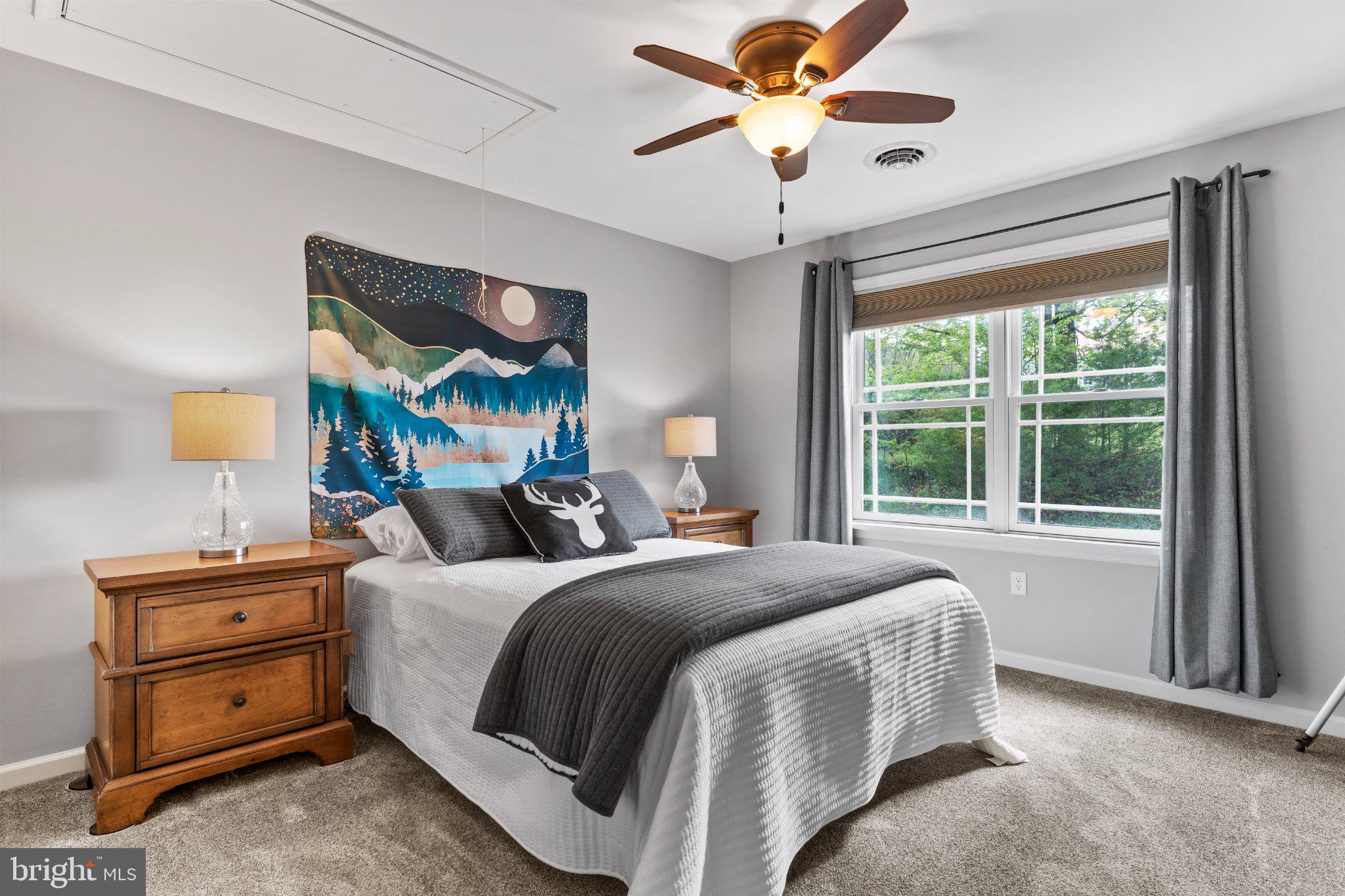 502 Creek Road Carlisle, PA 17013 - Photo 8 of 43 Serene bedroom with nature-inspired art.