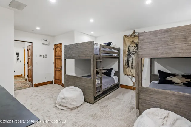 a bedroom with furniture and a bed