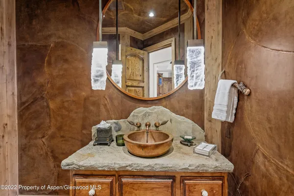 a balcony with furniture and a potted plant