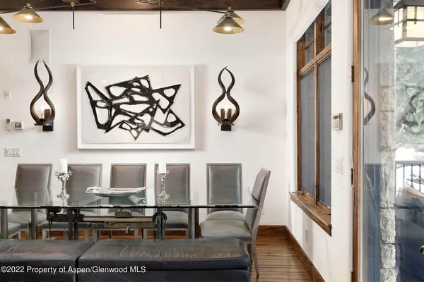 a view of a chairs and table in a balcony