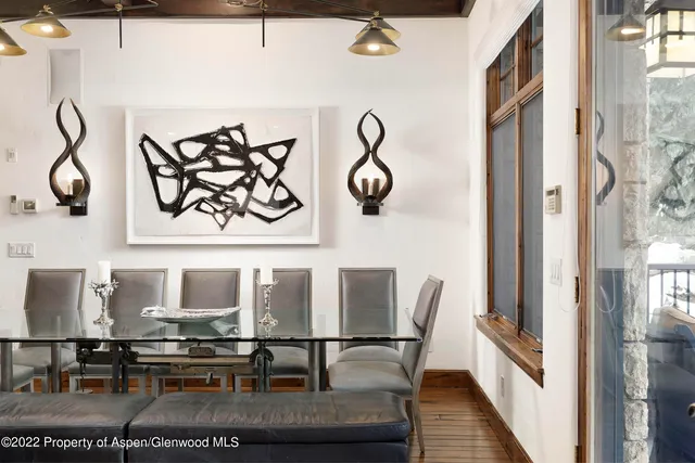 a view of a chairs and table in a balcony