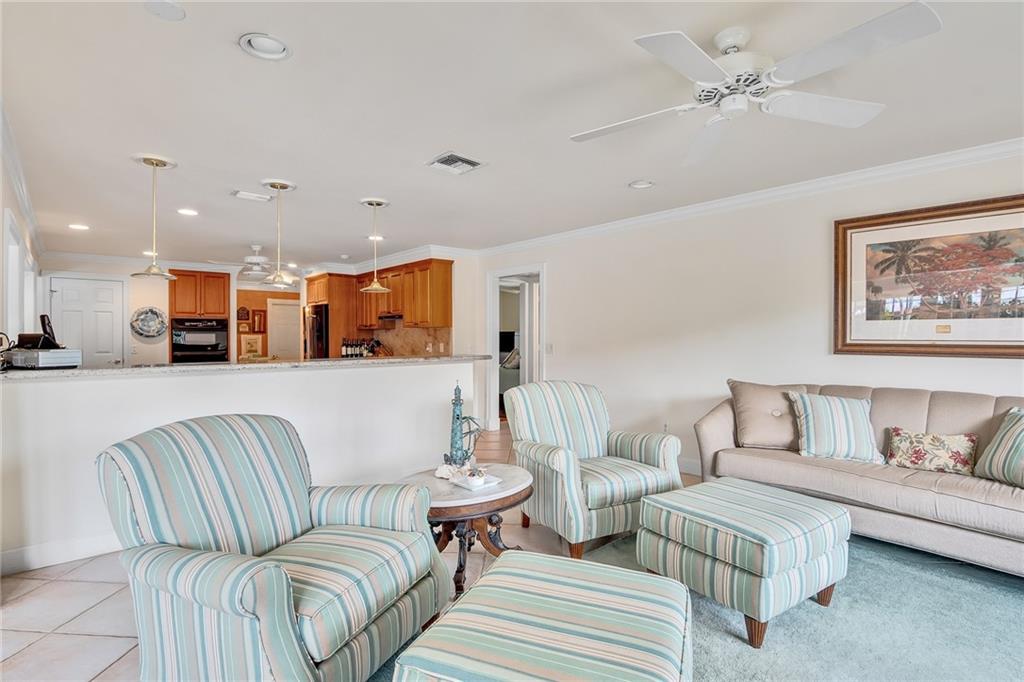 1626 Indian Bay Drive Vero Beach, FL 32963 - Photo 16 of 35 a living room with furniture and kitchen view