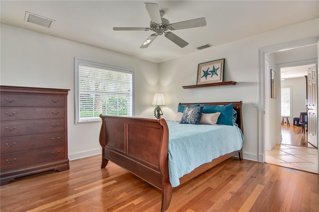 1626 Indian Bay Drive Vero Beach, FL 32963 - Photo 23 of 35 a bedroom with a bed and a window