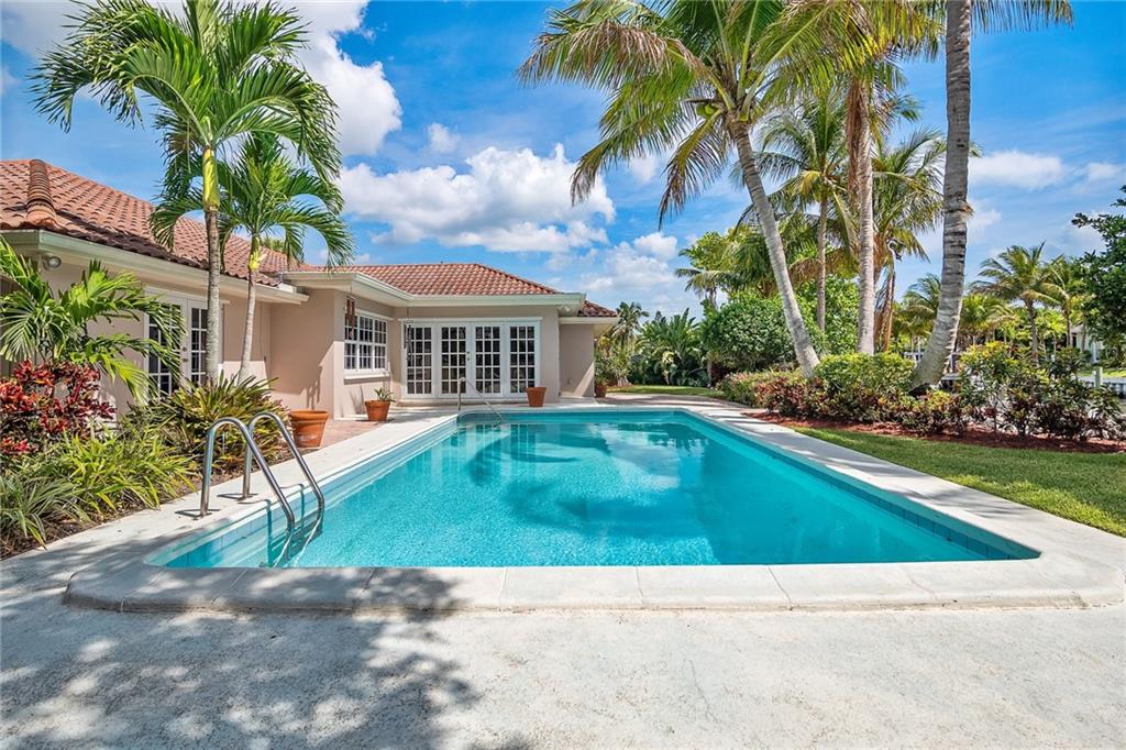 1626 Indian Bay Drive Vero Beach, FL 32963 - Photo 26 of 35 a view of swimming pool with a garden