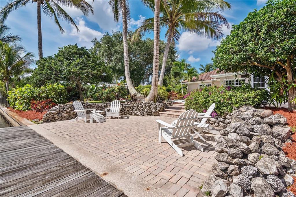 1626 Indian Bay Drive Vero Beach, FL 32963 - Photo 28 of 35 a view of a backyard with sitting area