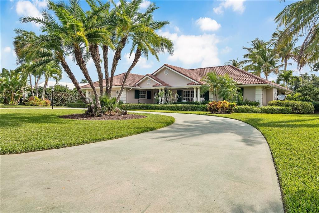 1626 Indian Bay Drive Vero Beach, FL 32963 - Photo 4 of 35 a front view of house with yard and green space