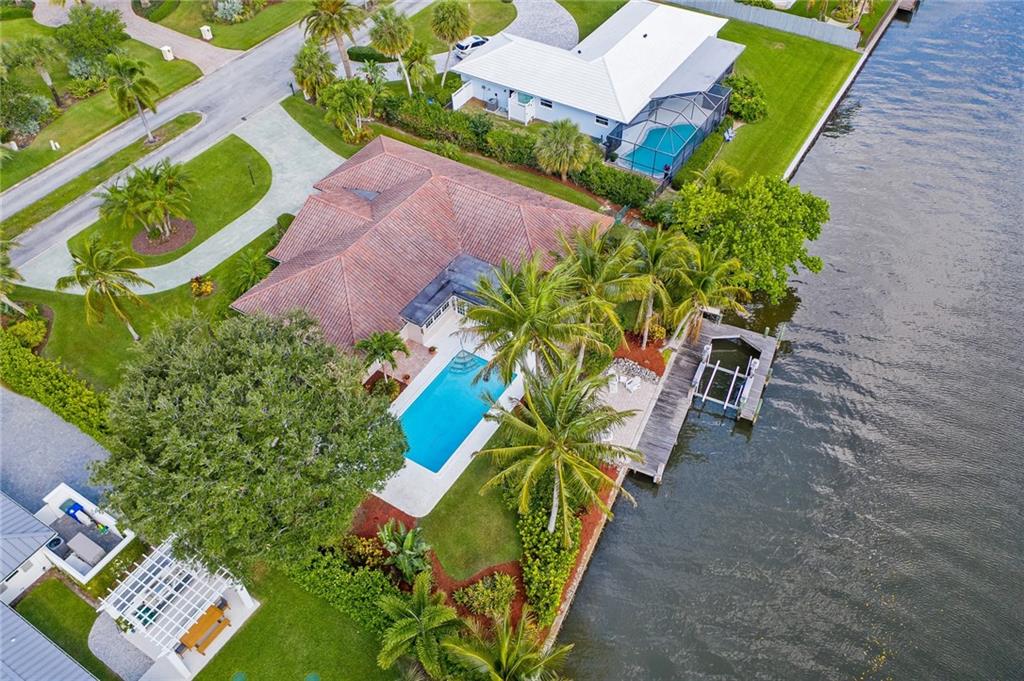1626 Indian Bay Drive Vero Beach, FL 32963 - Photo 31 of 35 an aerial view of a house with a yard and garden