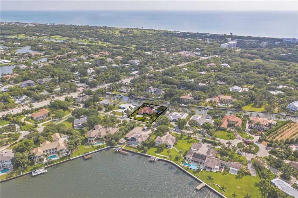 1626 Indian Bay Drive Vero Beach, FL 32963 - Photo 32 of 35 an aerial view of residential houses with outdoor space and trees