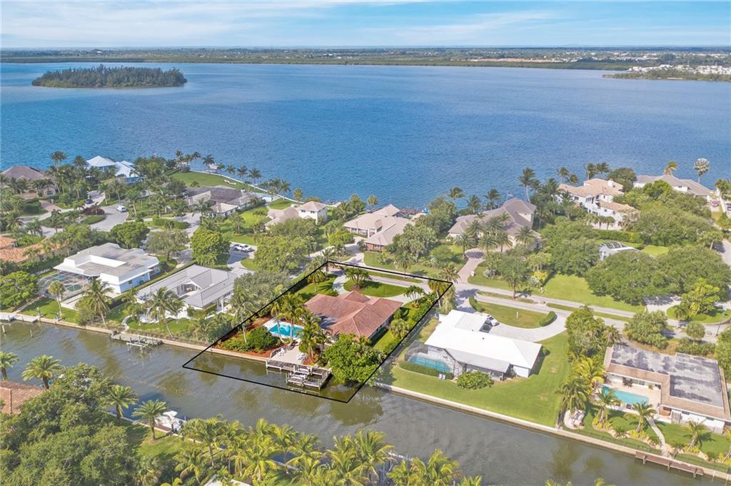 1626 Indian Bay Drive Vero Beach, FL 32963 - Photo 33 of 35 an aerial view of a house with a lake view