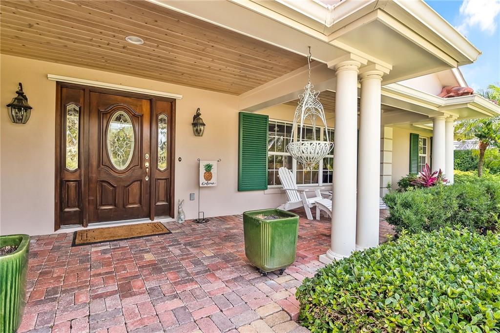 1626 Indian Bay Drive Vero Beach, FL 32963 - Photo 6 of 35 a front view of a house with garden