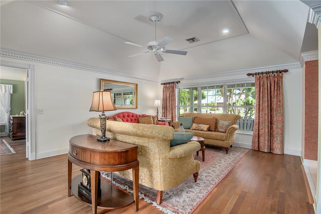 1626 Indian Bay Drive Vero Beach, FL 32963 - Photo 8 of 35 a living room with furniture and a wooden floor